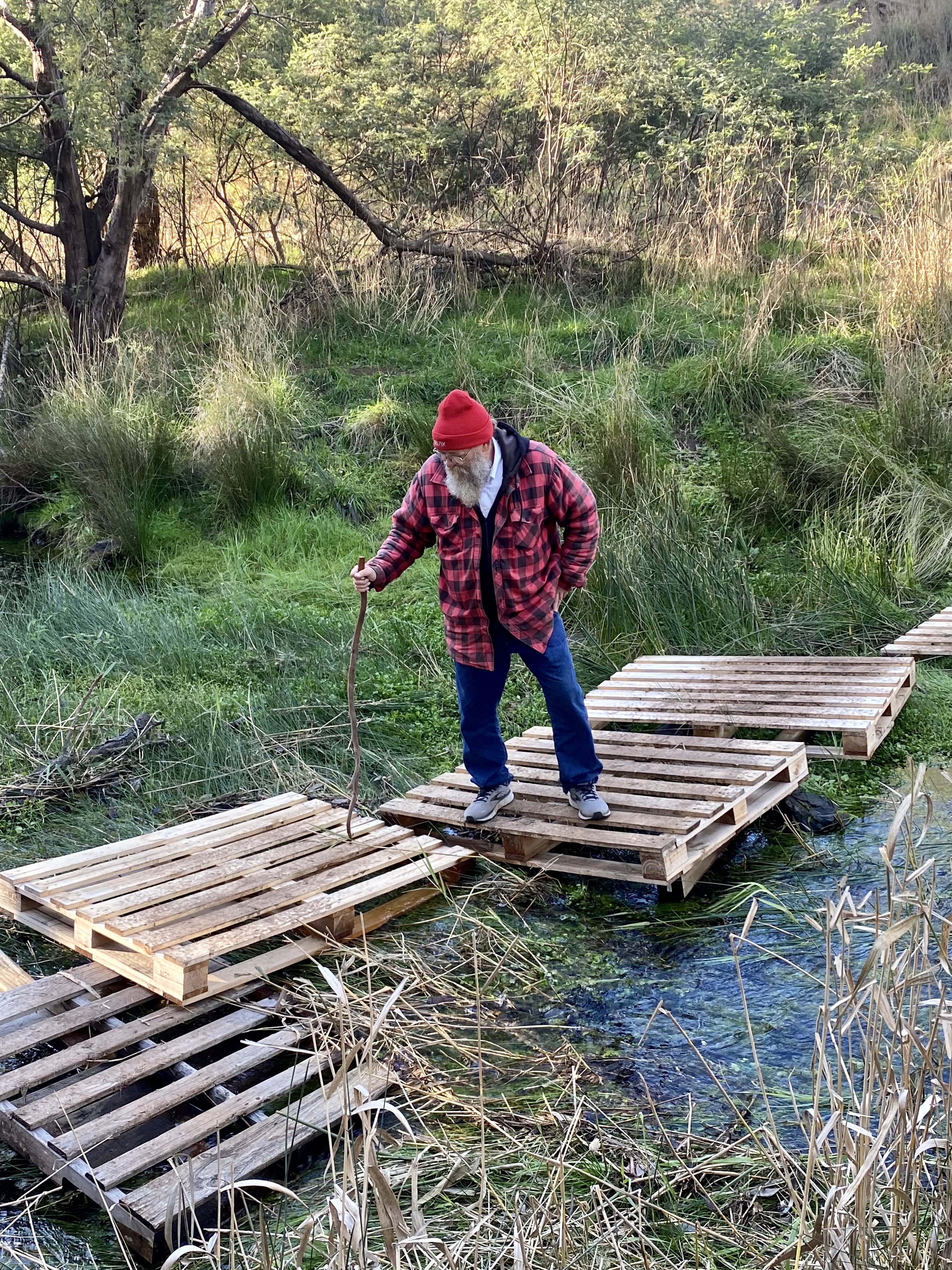 Lazarus Lake crossing Deep Creek on the pallet bridge at The Farm at Mirrim Wurnit, 2022